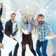 Group-of-joyful-excited-business-people-throwing-papers-and-having-fun-in-office